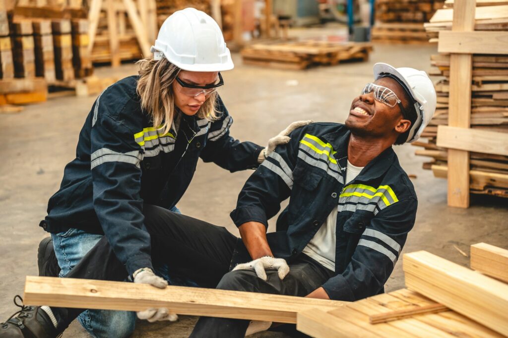 Warehouse worker has work related accident falls while trying to pick up wooden, accident insurance